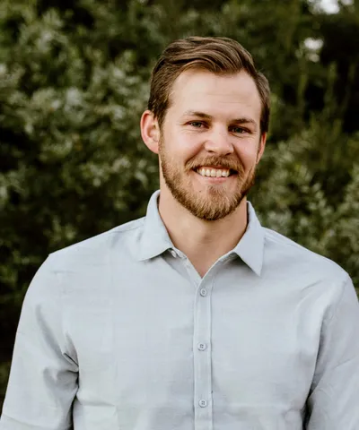 Jake Hartson, smiling, outdoor portrait.